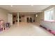 Large basement featuring carpet flooring, recreational games, and ample open space for activities at 1559 Redsunset Dr, Brownsburg, IN 46112