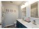 Modern bathroom with double sinks, framed mirrors, and coastal decor for a refreshing space at 1559 Redsunset Dr, Brownsburg, IN 46112