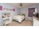 Cozy bedroom with a vanity, soft carpet, and a comfortable bed for a serene living space at 1559 Redsunset Dr, Brownsburg, IN 46112