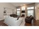 Bright and airy living room featuring a fireplace, built-in shelving, and hardwood floors at 1559 Redsunset Dr, Brownsburg, IN 46112