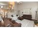 Open-concept living room with hardwood floors, a fireplace, and seamless transitions to other living spaces at 1559 Redsunset Dr, Brownsburg, IN 46112