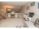 Loft area with a study space, a chandelier, views into the living room, and cozy seating at 1559 Redsunset Dr, Brownsburg, IN 46112
