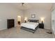 Bright main bedroom with a high ceiling, hardwood floors, and comfortable furnishings at 1559 Redsunset Dr, Brownsburg, IN 46112