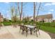 Outdoor patio with a glass table and seating, perfect for entertaining and enjoying outdoor living at 1559 Redsunset Dr, Brownsburg, IN 46112