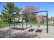 Community playground featuring swings and play equipment, set in a well-maintained green space at 1559 Redsunset Dr, Brownsburg, IN 46112