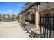Covered pergola next to fenced community pool area with pillars and decorative stone accents at 1559 Redsunset Dr, Brownsburg, IN 46112