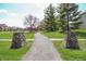 Neighborhood walking path with decorative rock pillars for an enjoyable stroll outdoors at 1559 Redsunset Dr, Brownsburg, IN 46112