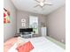Comfortable bedroom featuring a ceiling fan and a desk area at 16311 Sunland Ct, Westfield, IN 46074