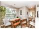 Cozy dining area with a wooden table and view of the adjacent bedroom at 16311 Sunland Ct, Westfield, IN 46074