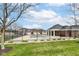 Community pool surrounded by a black fence, set against a backdrop of red brick townhomes at 16311 Sunland Ct, Westfield, IN 46074