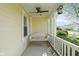 Cozy front porch with a hanging swing and a decorative birdhouse for relaxation at 1920 Mystic Bay Ct, Indianapolis, IN 46240