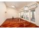 Spacious living area with hardwood floors, a ceiling fan, and natural light from sliding doors at 1920 Mystic Bay Ct, Indianapolis, IN 46240