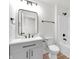 Modern bathroom with black hardware, single vanity, and a sleek shower tub at 2041 N Dexter St, Indianapolis, IN 46202