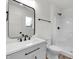 Modern bathroom with black hardware, single vanity, and a sleek shower tub at 2041 N Dexter St, Indianapolis, IN 46202