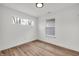 Bedroom with wood-look flooring and two windows, allowing for natural light at 2041 N Dexter St, Indianapolis, IN 46202