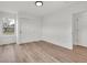 Bright bedroom with a closet, wood-look floors, and a window offering natural light at 2041 N Dexter St, Indianapolis, IN 46202