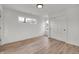 Bedroom with wood-look flooring and a closet; two windows provide natural light at 2041 N Dexter St, Indianapolis, IN 46202