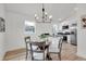 Cozy dining space featuring a glass table, stylish chairs, and modern lighting fixture at 2041 N Dexter St, Indianapolis, IN 46202