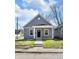 Charming single-story home with gray siding, a front porch, and a newly installed sidewalk at 2041 N Dexter St, Indianapolis, IN 46202