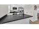 Modern kitchen with white cabinets, stainless steel appliances, and sleek countertops at 2041 N Dexter St, Indianapolis, IN 46202