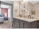 Bathroom showcasing a double sink vanity with fixtures and view into bedroom at 211 N Merrill St, Fortville, IN 46040