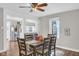 Cozy dining area with stylish furniture and a view into the open kitchen at 211 N Merrill St, Fortville, IN 46040