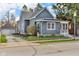 Charming home with gray siding, a detached garage, and landscaping, offering classic curb appeal at 211 N Merrill St, Fortville, IN 46040
