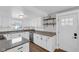 Modern kitchen featuring white cabinets, granite countertops and stainless steel appliances at 211 N Merrill St, Fortville, IN 46040