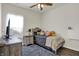 Well-lit bedroom with gray rug and accents, window, and modern furnishings at 2307 Cedarmill Dr, Franklin, IN 46131