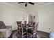 Cozy dining room features a round table, four chairs, and natural light from the window at 2307 Cedarmill Dr, Franklin, IN 46131