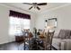 Cozy dining room features a round table, four chairs, and natural light from the window at 2307 Cedarmill Dr, Franklin, IN 46131