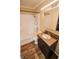 Bathroom featuring granite vanity and shower-tub, illuminated by modern lighting at 2317 St Peter St, Indianapolis, IN 46203
