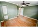 Bright bedroom featuring hardwood floors, fresh paint, and ample natural light at 2317 St Peter St, Indianapolis, IN 46203