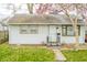 Charming home with a manicured lawn and blossoming tree in a quiet neighborhood at 2317 St Peter St, Indianapolis, IN 46203