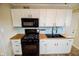 Newly renovated kitchen with white cabinets, modern appliances, and butcher block countertops at 2317 St Peter St, Indianapolis, IN 46203