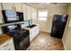 Modern kitchen with butcher block counters, black appliances, and light-blue backsplash at 2317 St Peter St, Indianapolis, IN 46203