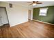 Spacious living room with wood flooring, neutral walls, and ceiling fan fixture at 2317 St Peter St, Indianapolis, IN 46203