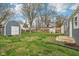Spacious backyard featuring a well-maintained lawn, shed, and detached garage, perfect for outdoor activities at 2336 St Paul St, Indianapolis, IN 46203