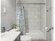 Bathroom featuring stylish tile surround, modern vanity, and tub at 2336 St Paul St, Indianapolis, IN 46203