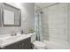 Well-lit bathroom featuring a shower, stylish vanity, and modern fixtures at 2336 St Paul St, Indianapolis, IN 46203