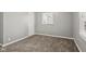 Cozy bedroom featuring carpet flooring, neutral paint colors, and a closet for ample storage at 2336 St Paul St, Indianapolis, IN 46203