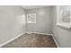 This bedroom features neutral paint colors, and a large window providing ample light at 2336 St Paul St, Indianapolis, IN 46203