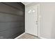 Entryway featuring a white front door and a decorative black accent wall at 2336 St Paul St, Indianapolis, IN 46203