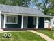Charming single-story home with a welcoming front porch and well-maintained lawn at 2336 St Paul St, Indianapolis, IN 46203