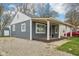 Charming home with covered porch and a gravel driveway at 2336 St Paul St, Indianapolis, IN 46203