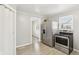 Efficient kitchen design with stainless steel fridge and modern flooring at 2336 St Paul St, Indianapolis, IN 46203