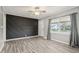 Bright living room with gray walls, light wood floors, and decorative wall at 2336 St Paul St, Indianapolis, IN 46203