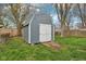 Outdoor backyard shed with a gray exterior, white doors, and a ramp for easy access at 2336 St Paul St, Indianapolis, IN 46203