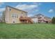 Expansive backyard with a well-maintained lawn and a deck offers ample space for outdoor activities at 2889 Grimes Way, Columbus, IN 47201