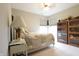 Cozy bedroom with natural light, displays of collectibles, and soft carpeting at 2889 Grimes Way, Columbus, IN 47201